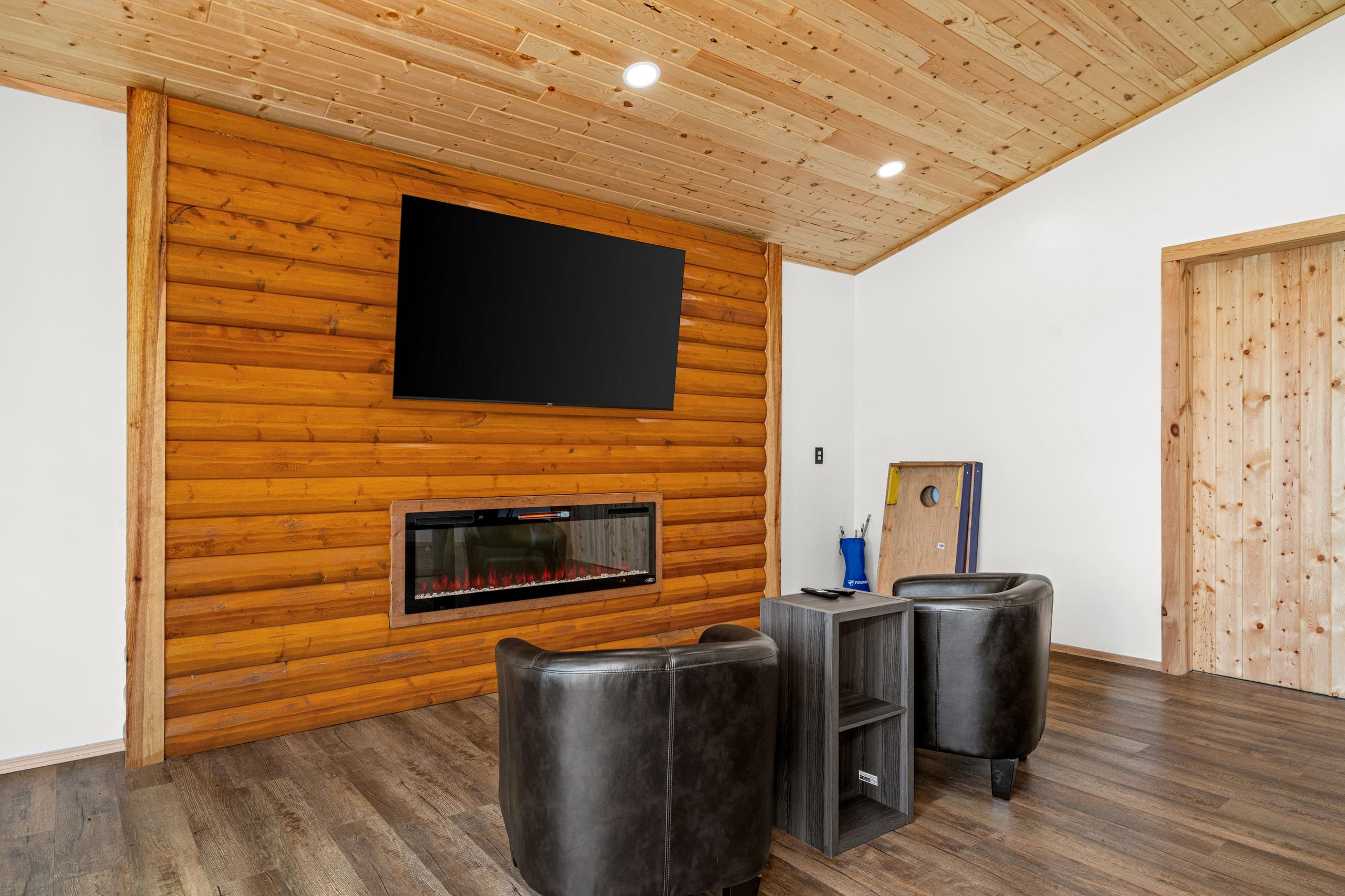 Lounge with a fireplace and leather chairs