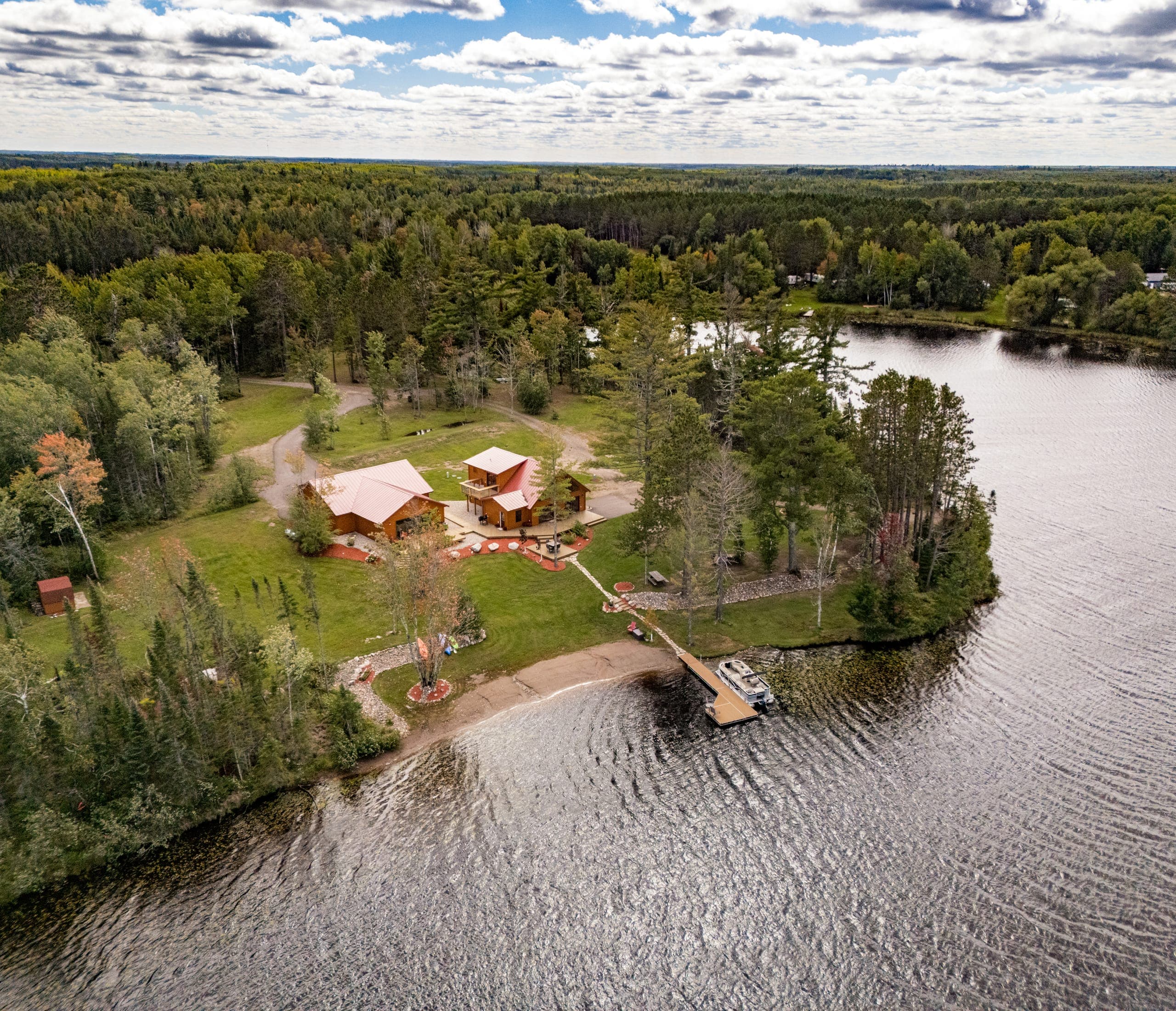 Daytime aerial of the point, beach, and dock