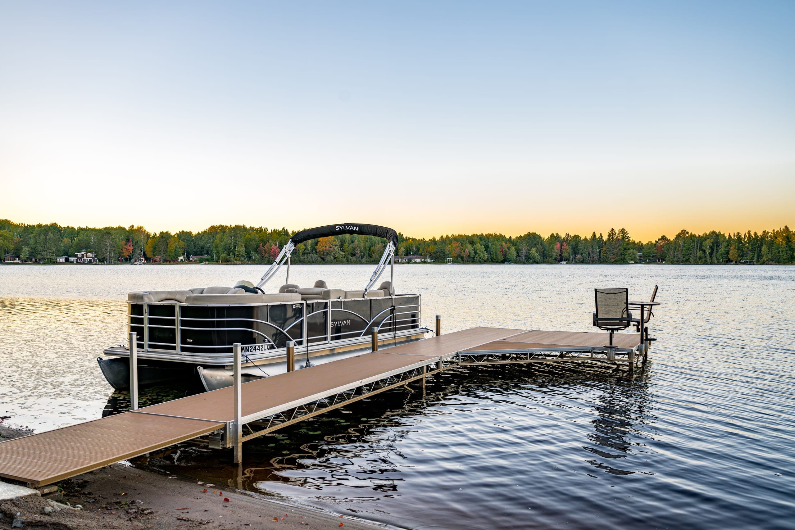 Pontoon boat tied at the dock in the evening light