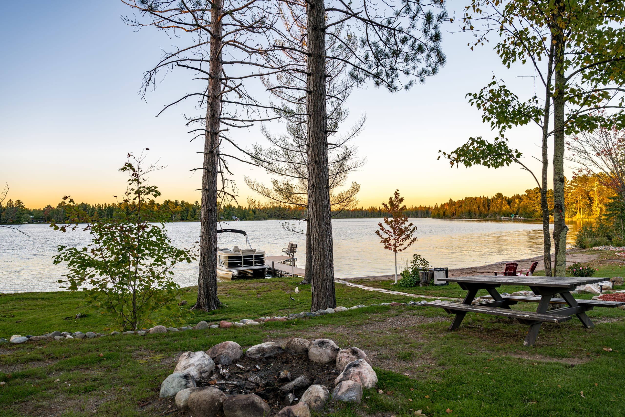 Fire pit and picnic table above the lake
